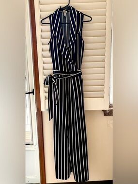 A new day Black and White Striped Jumpsuit with waist tie. Side zipper for